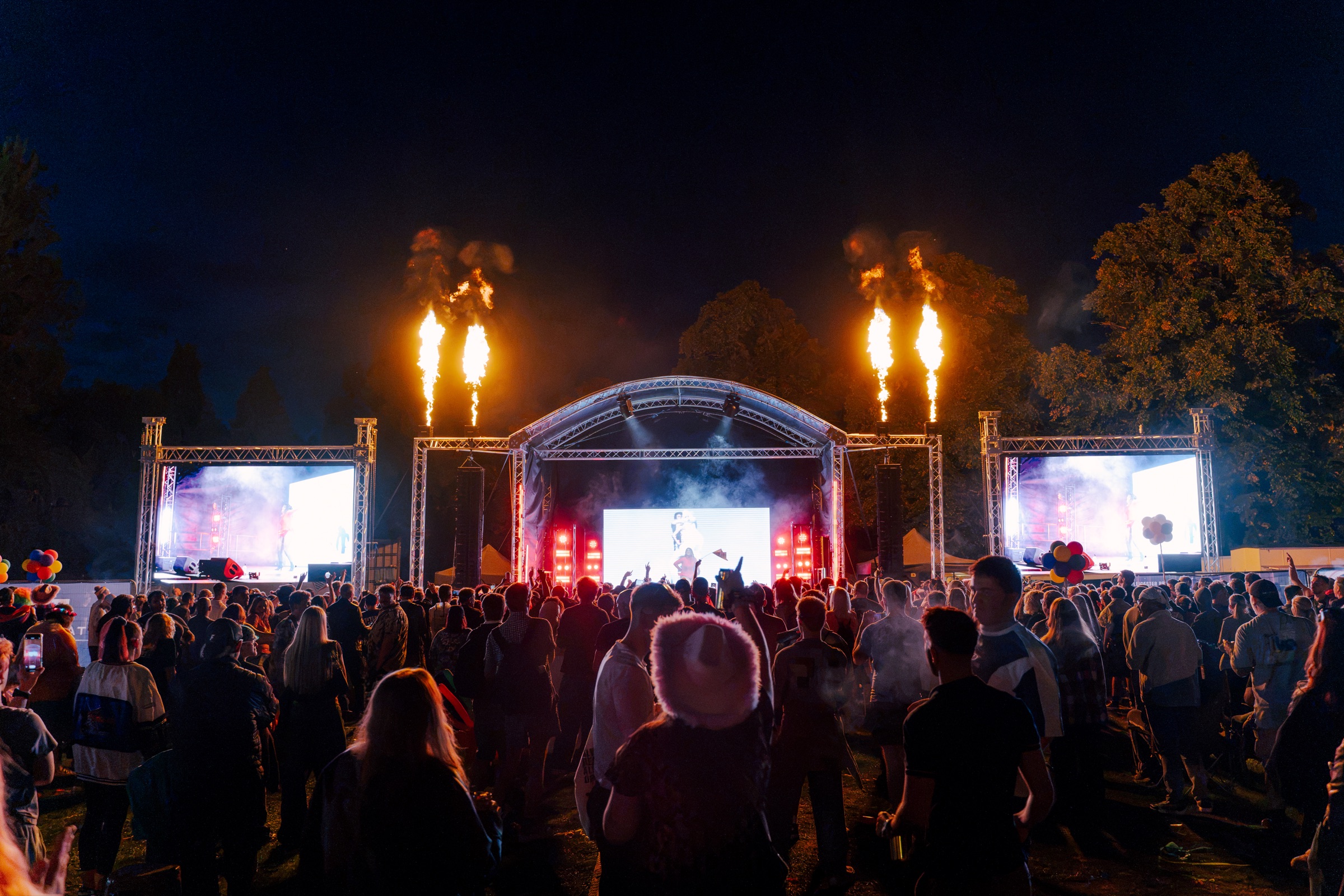 Leicester Pride 2026 main stage with flame effects and crowd at night