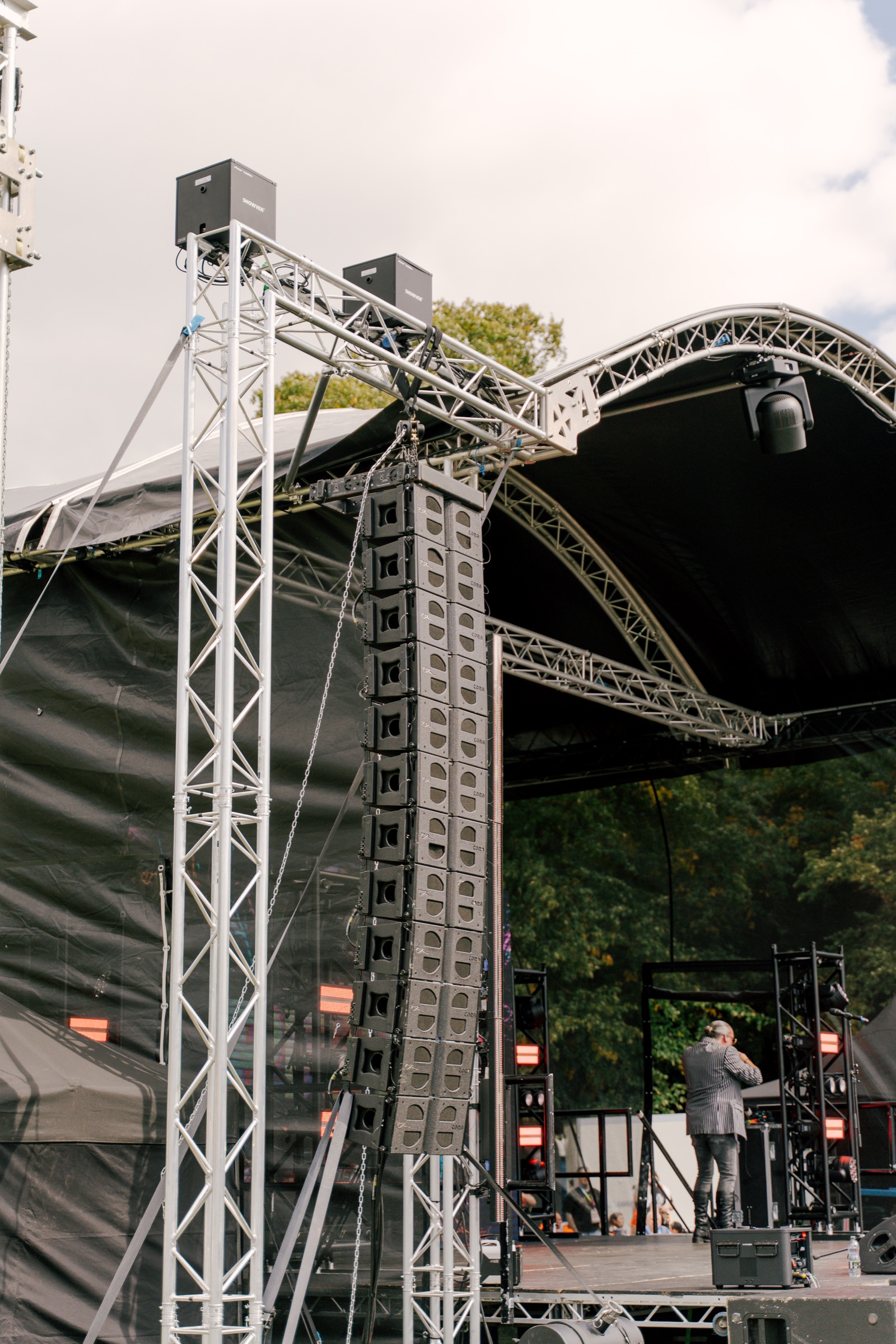 Line-array PA system flown beside the Leicester Pride 2026 stage