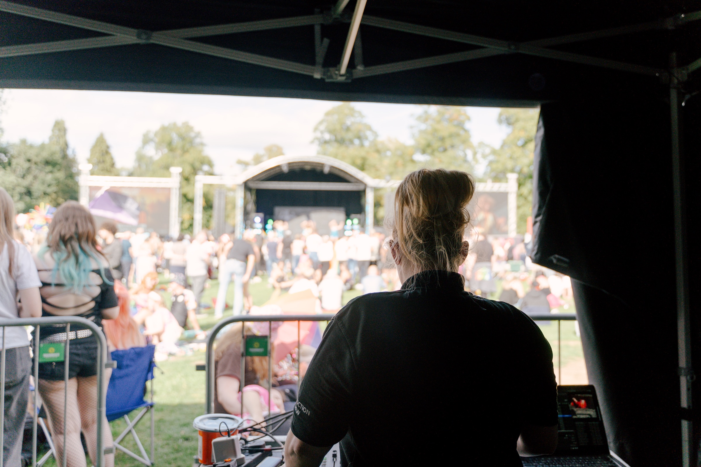 Production crew member looking towards the Leicester Pride 2026 stage